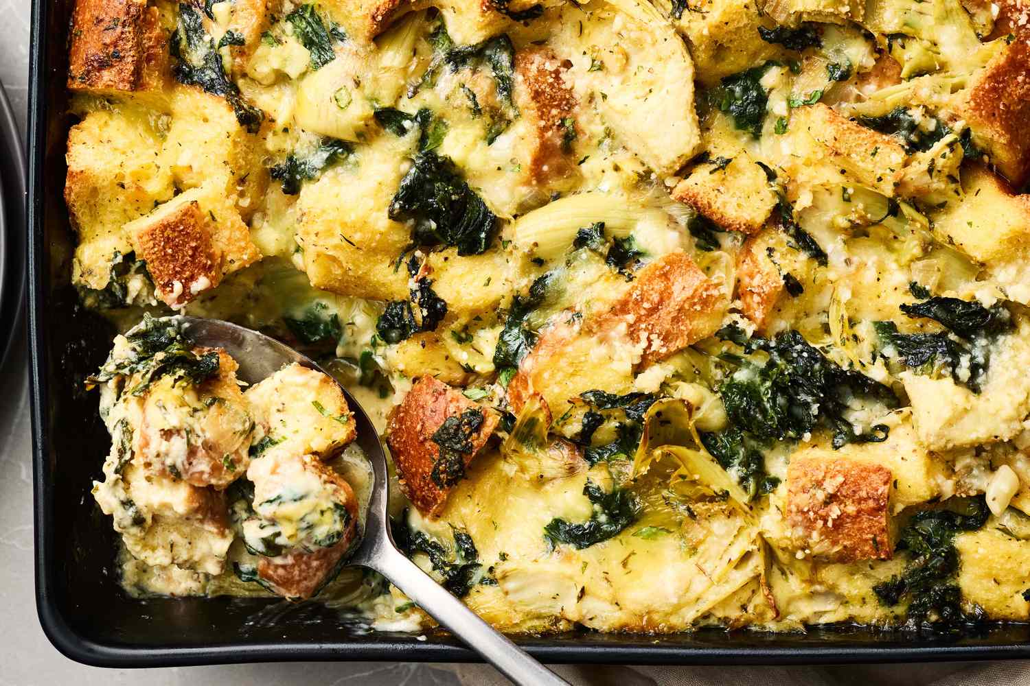 “Another notch!” Emeril Lagasse Savory Spinach and Artichoke Stuffing